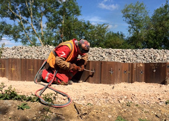 Oxy-acetylene holes cut for rebar then shuttering